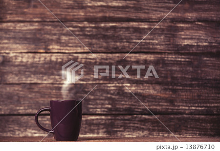 Tea or coffee cup on wooden table. 13876710