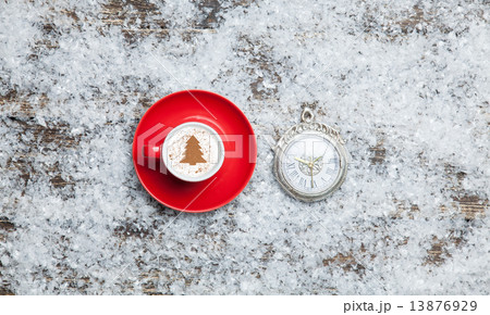 Cappuccino with christmas tree shape and clock on artificial bac Cappuccino with christmas tree shape and clock on artificial bac 13876929