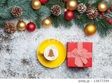 Cappuccino with christmas tree shape and gift box on artificial Cappuccino with christmas tree shape and gift box on artificial 13877294