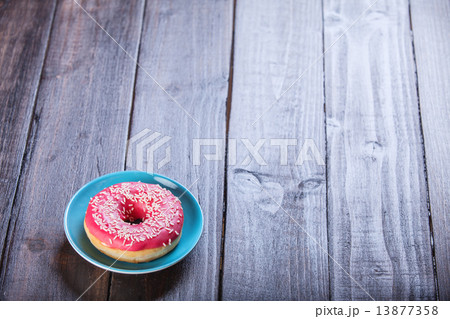 Donut on wooden table. Donut on wooden table. 13877358