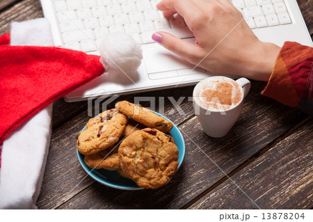 Cookie and women hand with notebook. Cookie and women hand with notebook. 13878204