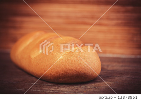 Delicious bread on a wood table 13878961