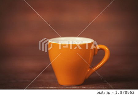 Little cup of the coffee on a wooden table 13878962