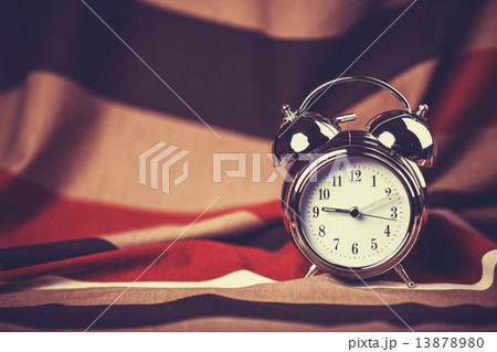 Alarm clock and scarf at background. Alarm clock and scarf at background. 13878980