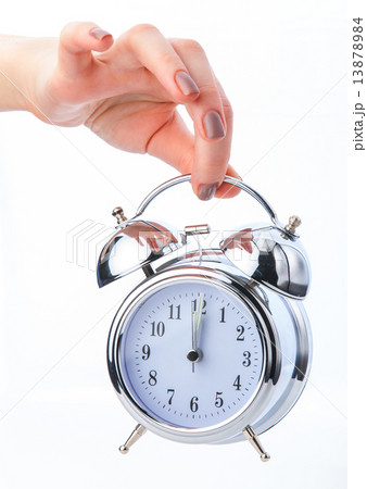 hand and retro clock on white background hand and retro clock on white background 13878984