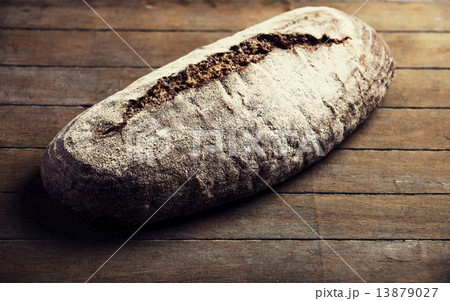 Delicious bread on a wood table Delicious bread on a wood table 13879027