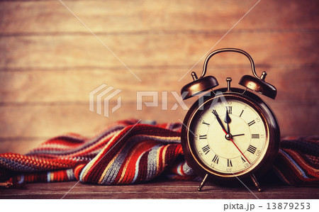 Alarm clock and scarf. 13879253