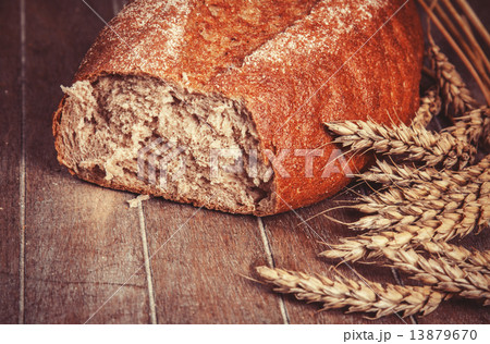 Delicious bread on a wood table 13879670