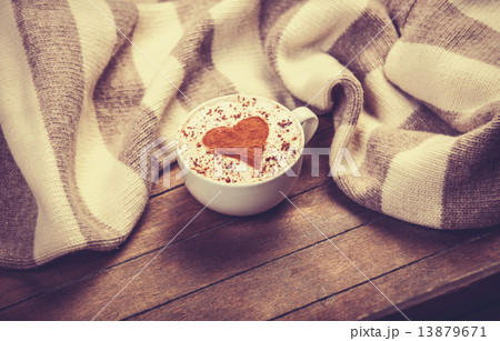Cup with coffee and scarf. 13879671