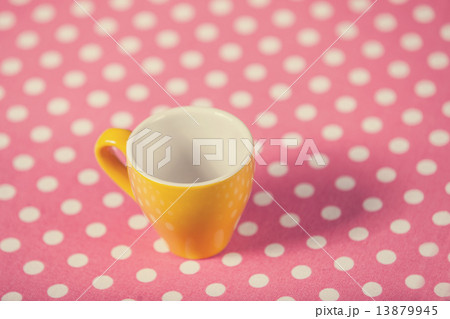 Cup of a coffe on polka dot cover 13879945