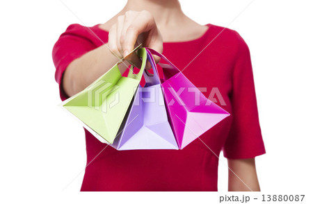 Women in red dress with little shopping bags 13880087