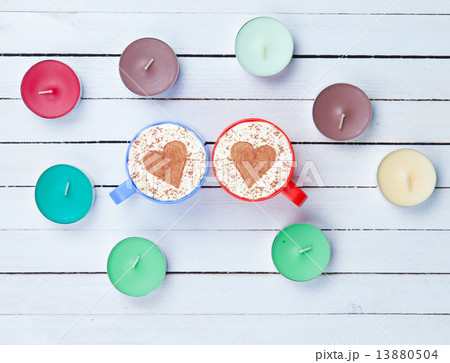 Cappuccino and candles on white background Cappuccino and candles on white background 13880504