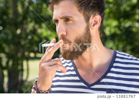 Hipster smoking electronic cigarette 13881767