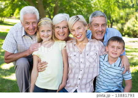 Happy family smiling at the camera 13881793