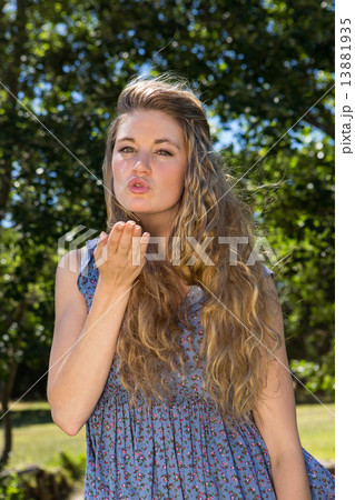Pretty blonde blowing a kiss 13881935