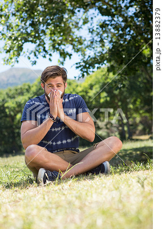 Handsome hipster blowing his nose Handsome hipster blowing his nose 13882379
