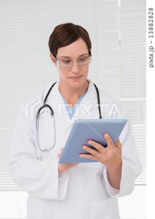 Doctor using tablet pc Doctor using tablet pc 13882828