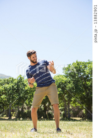 Handsome hipster playing air guitar 13882901