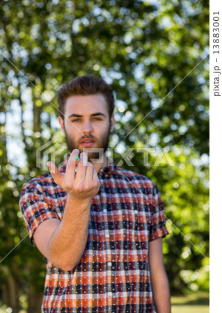 Hipster smoking an electronic cigarette 13883001
