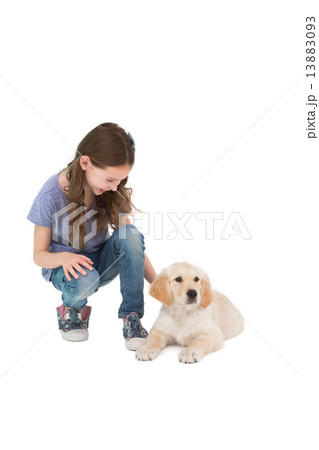 Crouching little girl next dog 13883093
