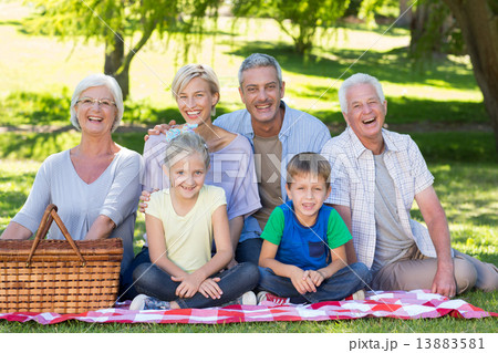 Happy family smiling at the camera Happy family smiling at the camera 13883581
