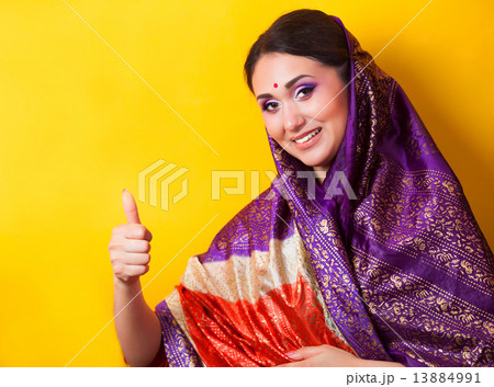 Indian girl on yellow background 13884991