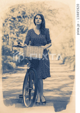 Beautiful girl with bike at countryside. Vintage. Beautiful girl with bike at countryside. Vintage. 13885920