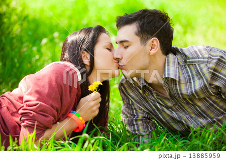 Couple Relaxing on Green Grass.Park. 13885959