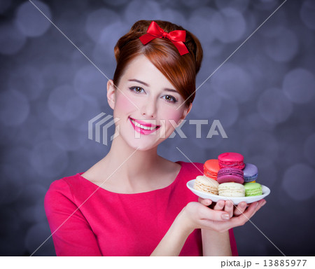 Redhead girl with macaron for St. Valentine Day. 13885977