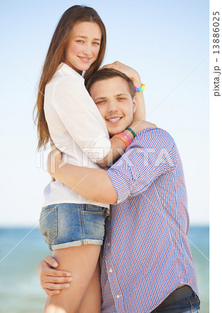 Portrait of young man and woman on a beach Portrait of young man and woman on a beach 13886025