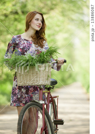 Girl on a bike in the countryside 13886087