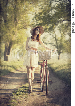 Girl on a bike in the countryside Girl on a bike in the countryside 13886104