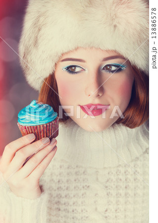 Redhead girl with cake. 13886578