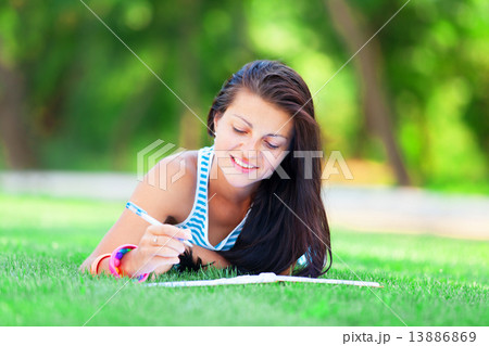 beautiful young brunette woman with note at outdoor beautiful young brunette woman with note at outdoor 13886869