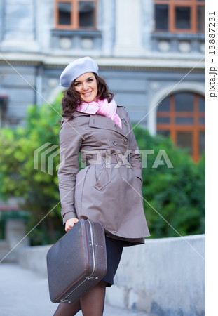 Women with suitcase at outdoor. Women with suitcase at outdoor. 13887231