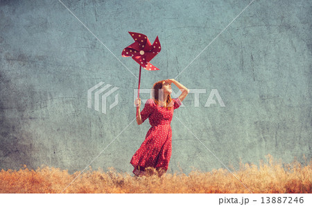Girl with wind turbine at field Girl with wind turbine at field 13887246