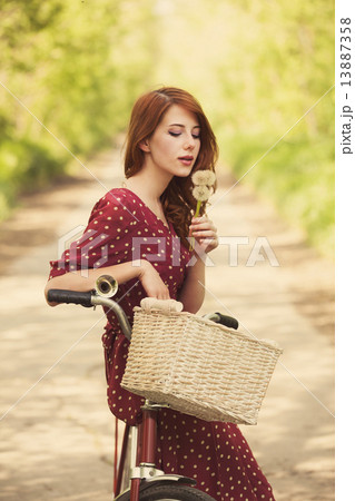 Beautiful girl with bike at countryside. Beautiful girl with bike at countryside. 13887358