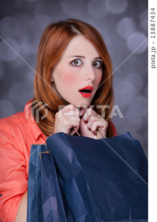 Redhead women with sopping bags. 13887434