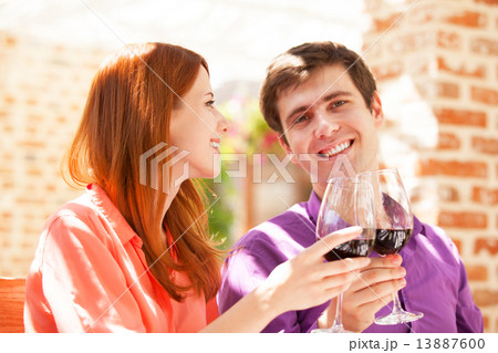 Couple drinking wine in the cafe 13887600