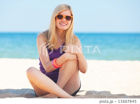 Beautiful blonde girl at the beach. Beautiful blonde girl at the beach. 13887645