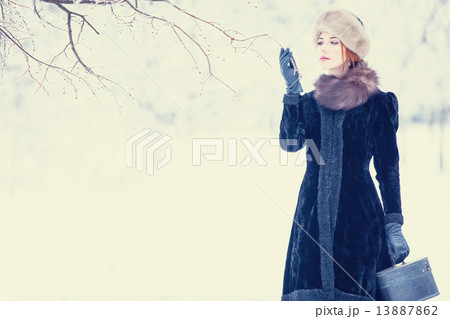 Beautiful redhead women with suitcase Beautiful redhead women with suitcase 13887862