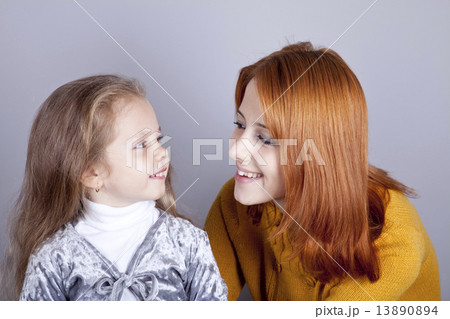 Two sisters looking at at each other 13890894