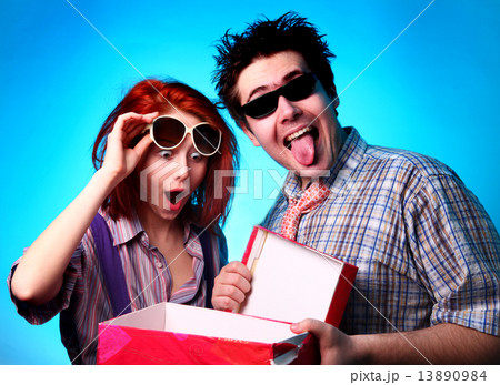 Fashion boy presenting a gift to girl 13890984