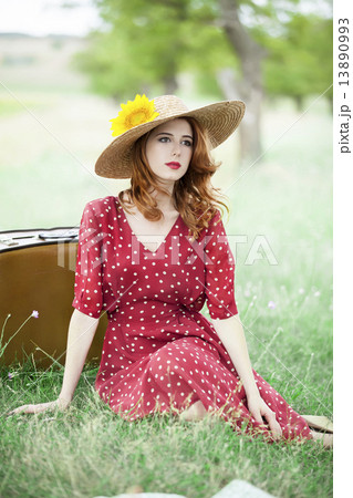 Redhead girl with sunflower at outdoor. Redhead girl with sunflower at outdoor. 13890993