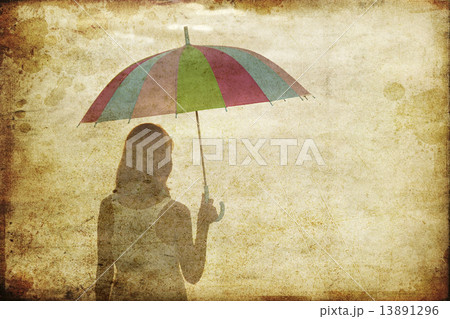 Girl with umbrella at sea coast. Photo in old image style. 13891296