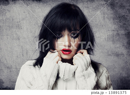 Portrait of a sad brunette. 13891375