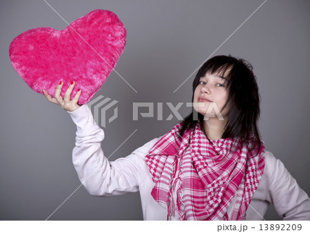 Funny girl with toy heart. 13892209