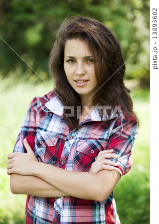 Beautiful teen girl in the park at green grass. Beautiful teen girl in the park at green grass. 13893602
