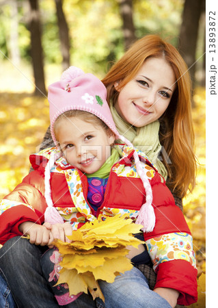 Mother and daughter in autumn yellow park Mother and daughter in autumn yellow park 13893872