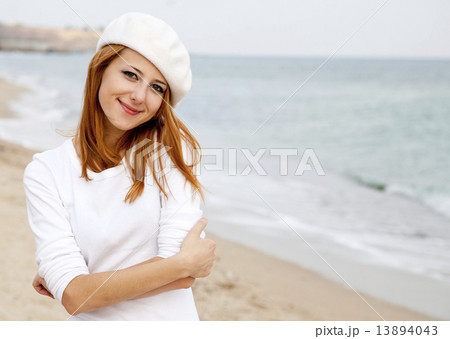 Young beautiful girl walking at the beach 13894043
